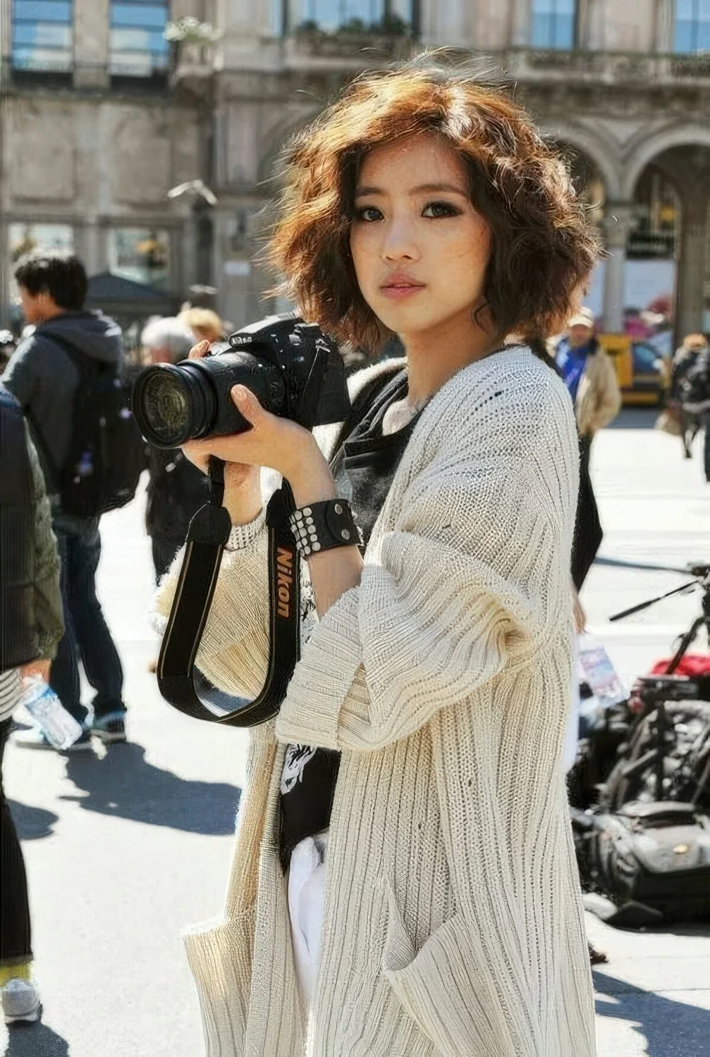 Messy wavy brown chin line bob with a lot of volume.