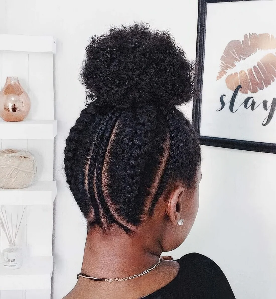 Braided back plus a large bun on top.