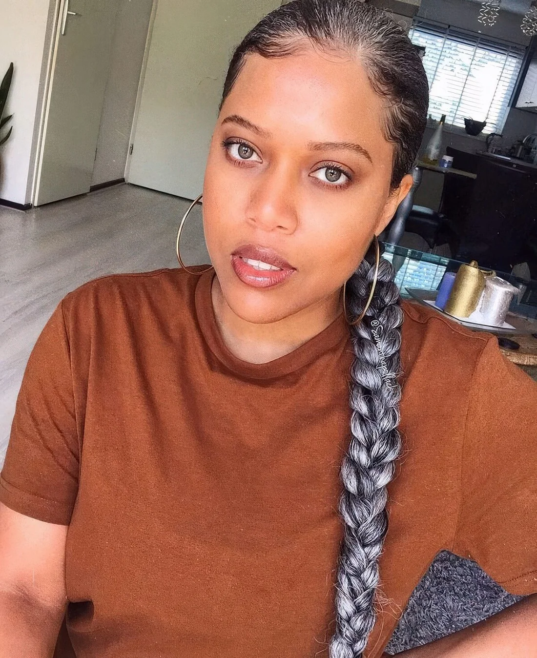 Photo showing braided low ponytail, with the hairstyle clearly visible.