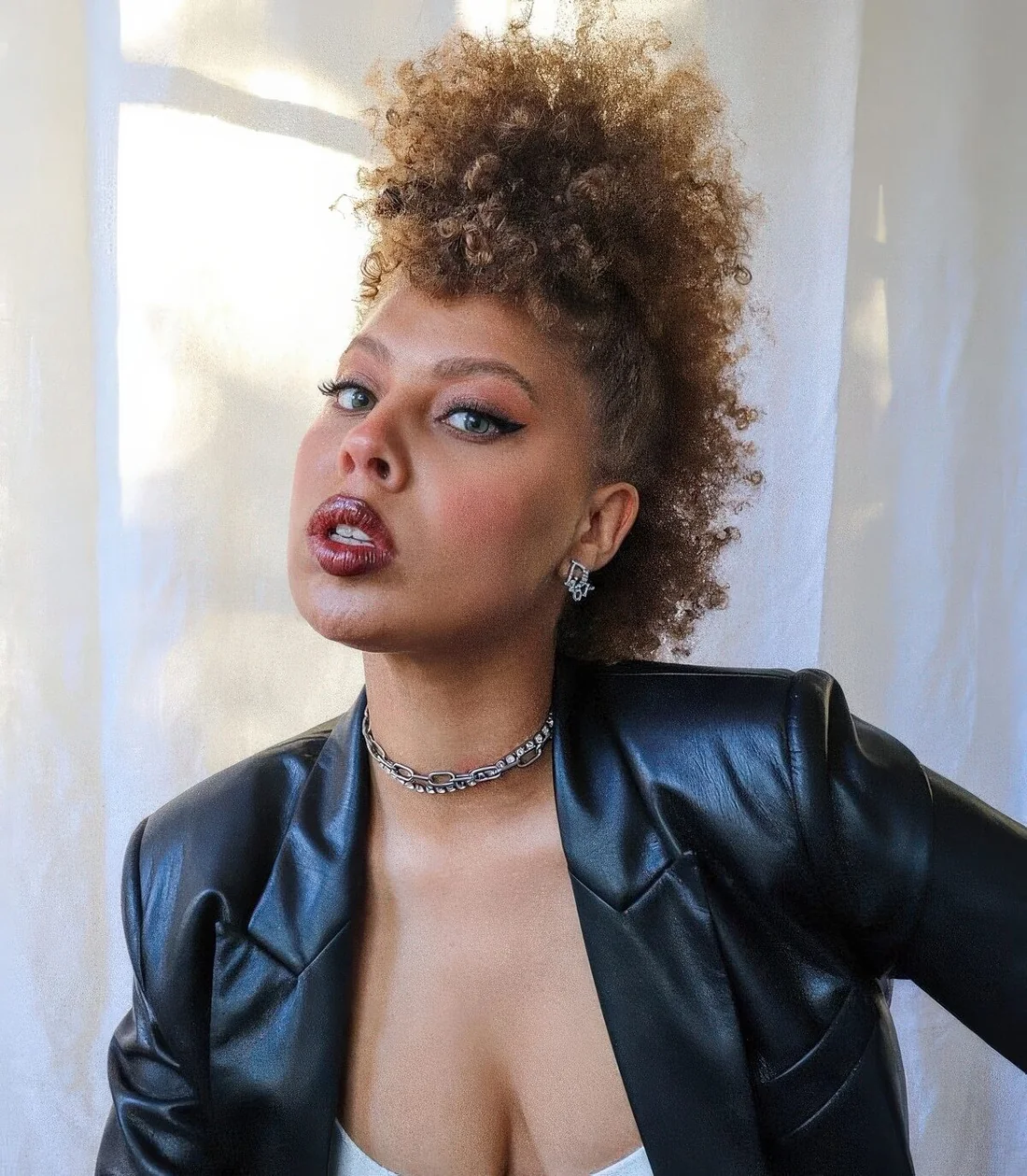 Photo showing fro hawk, with the hairstyle clearly visible.