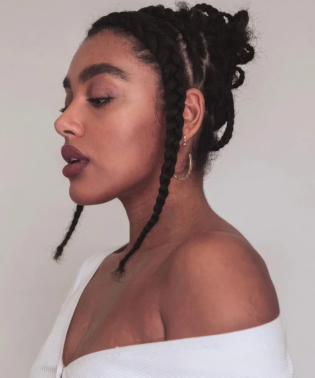 Photo showing chunky cornrows, with the hairstyle clearly visible.