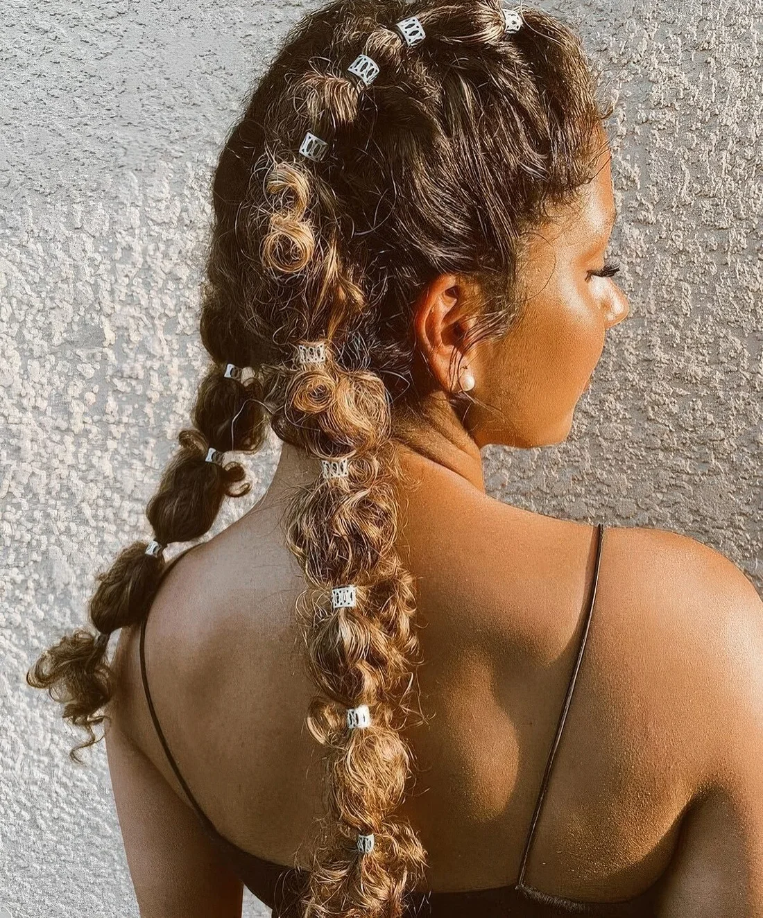 Photo showing this unique take on pigtails, with the hairstyle clearly visible.