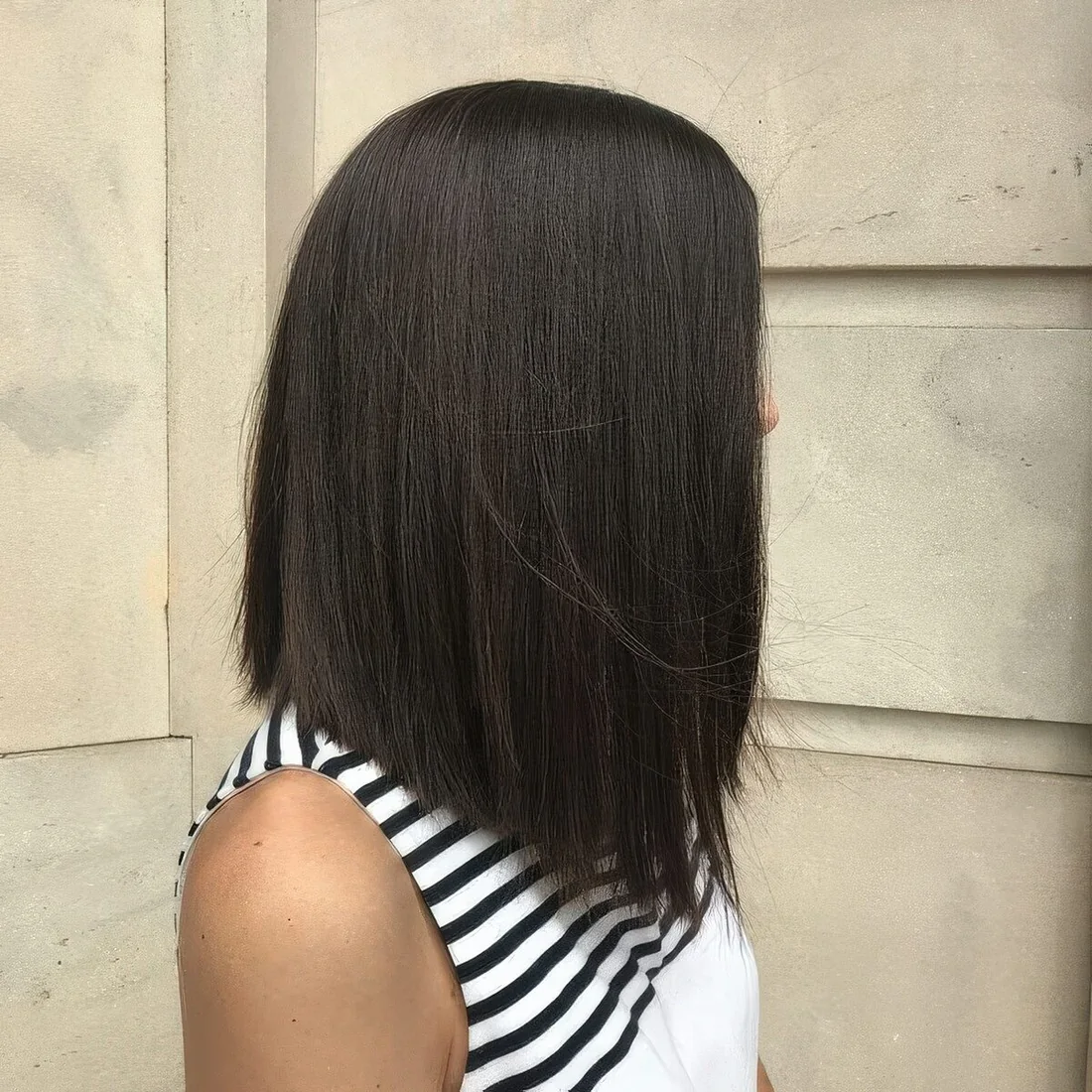 Photo showing chic black A line long bob, with the hairstyle clearly visible.