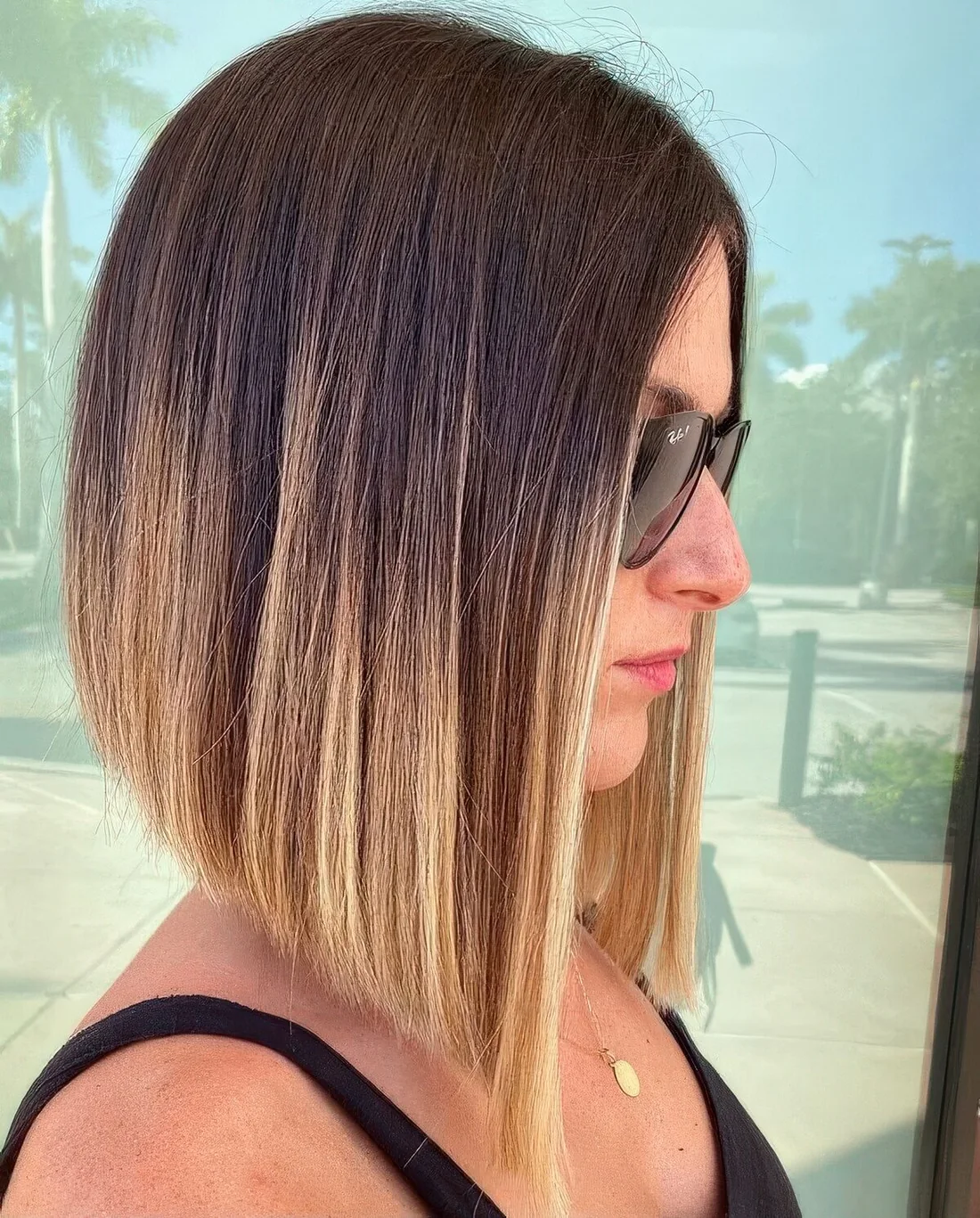 Long angled bob with a darker root and an ombre effect to blonde on the ends.