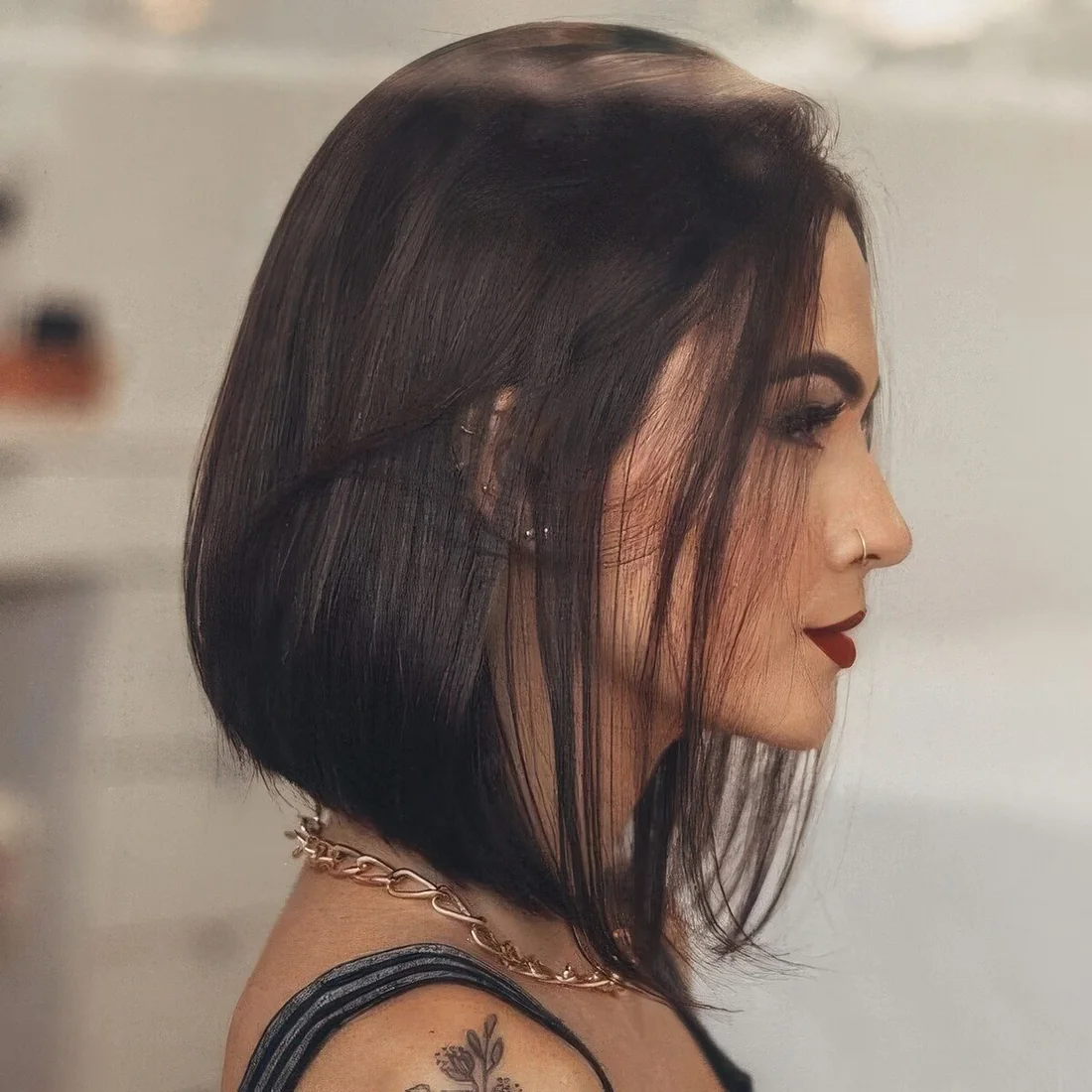 Refined and bold dark brunette A line bob with much volume.