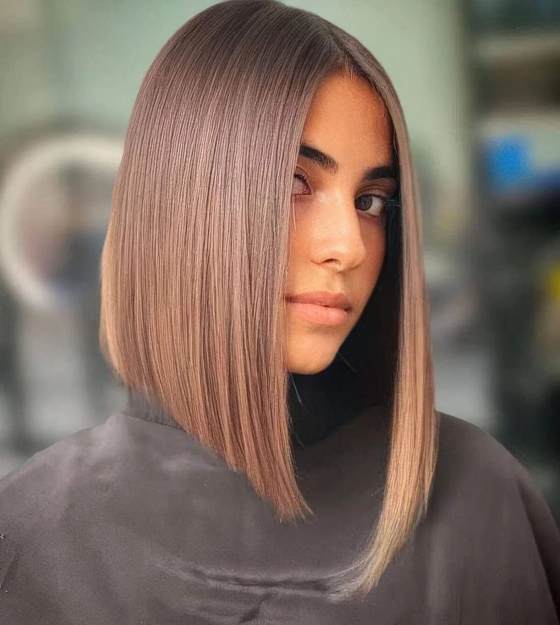 Eye catchy long asymmetrical bob in caramel tones.