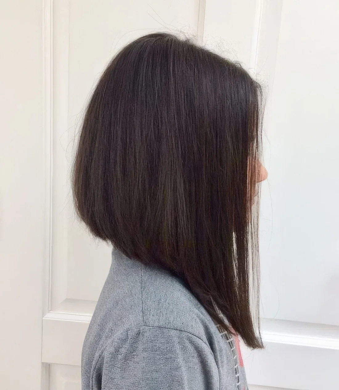 Long dark brunette A line bob with a lot of volume.
