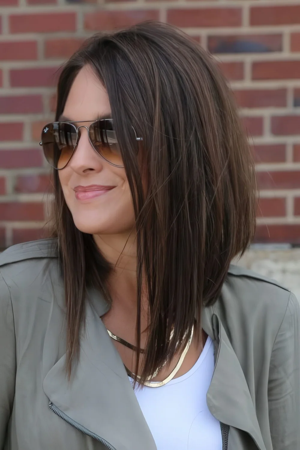 Long angled asymmetrical bob in chestnut with a texture.