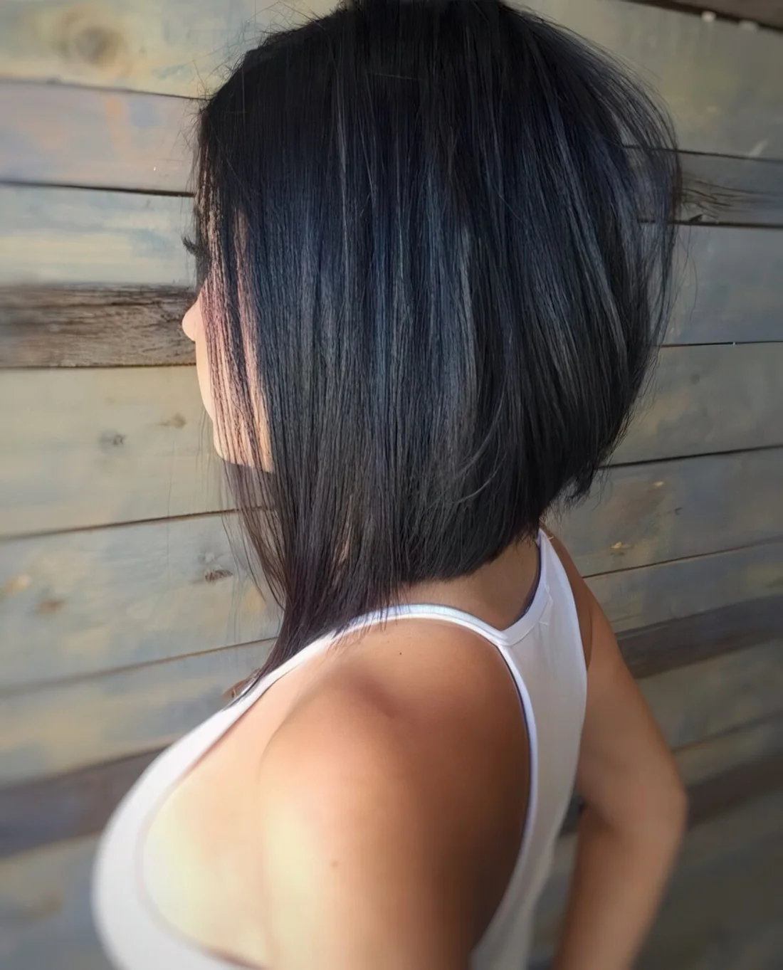 Photo showing black angled short bob haircut, with the hairstyle clearly visible.