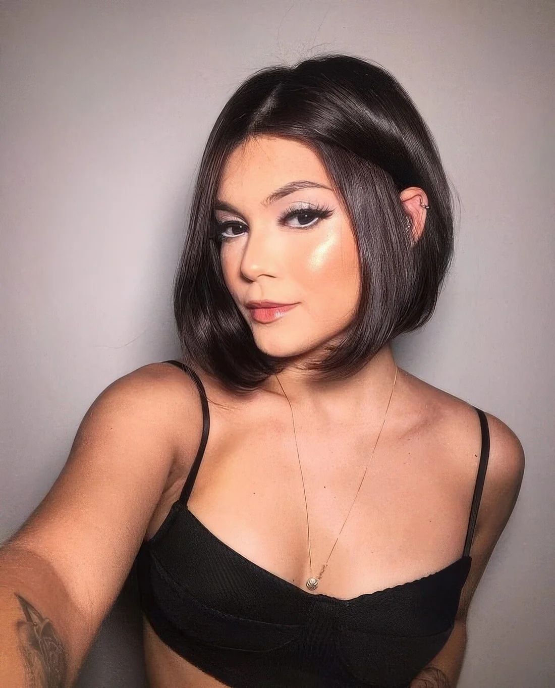 Sleek A line brunette bob with curled ends always.
