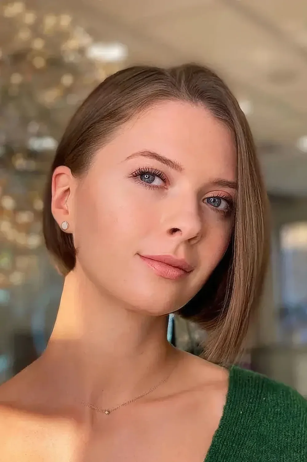 Caramel asymmetrical bob with side part.