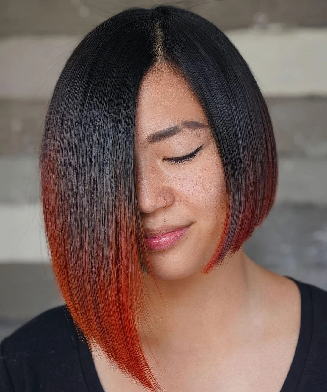 Asymmetrical black bob with red ends.
