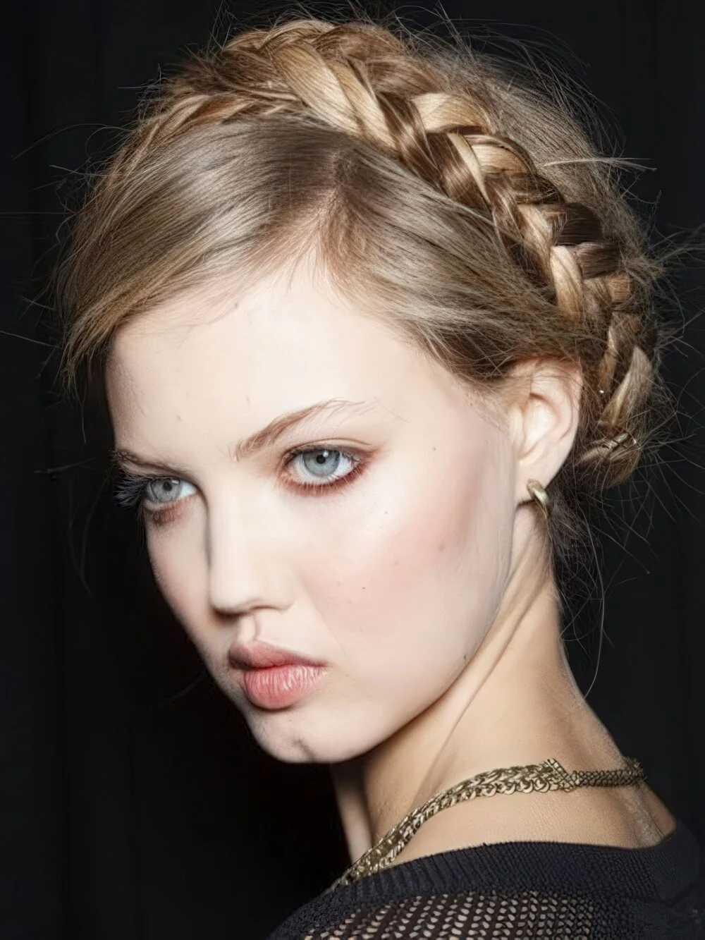 Braided blonde headband with loose lengths.