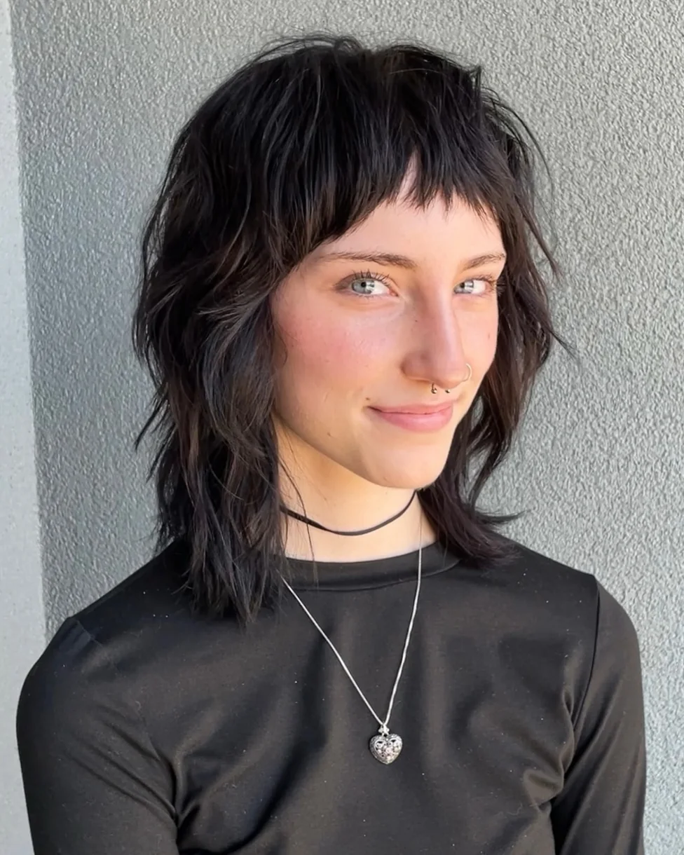 shoulder wavy chestnut shag with curtain fringe shown as a baby bangs idea, featuring textured finish