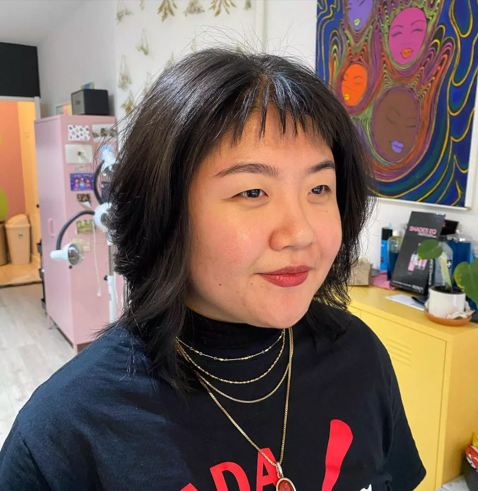 shoulder wavy vivid shag with curtain fringe shown as a baby bangs idea