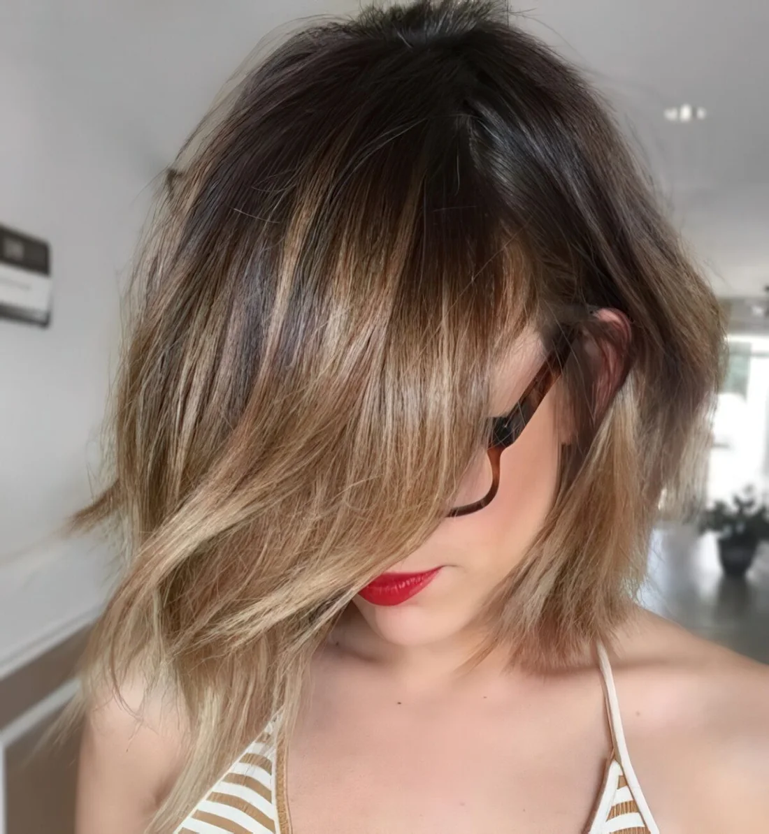 Choppy bob haircut with brunette balayage.