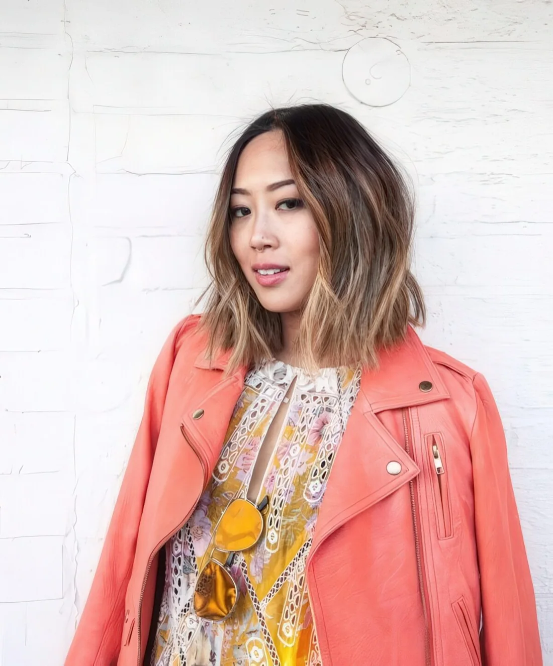 Short dark wavy bob with bronde balayage higlhlights.