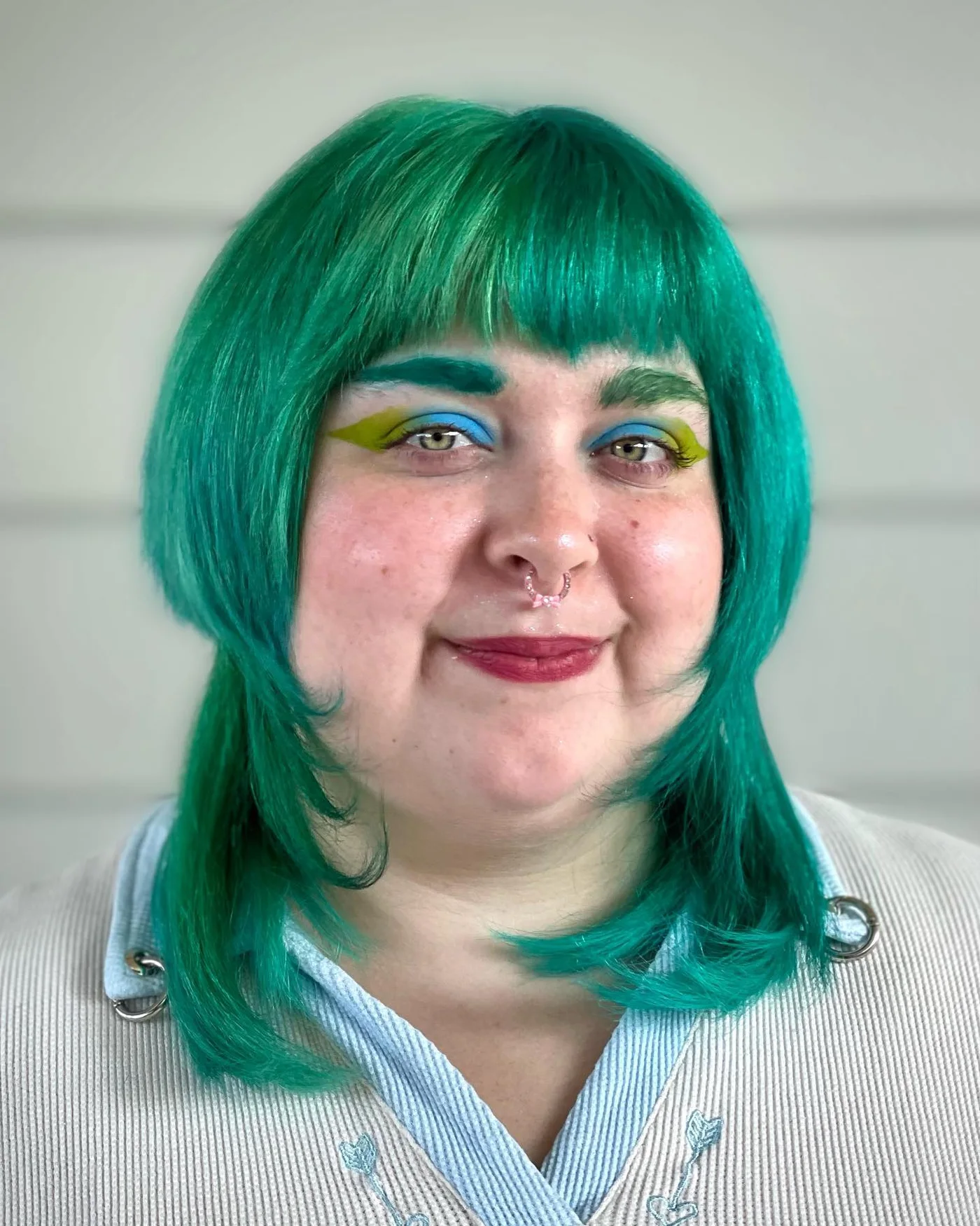 chin straight teal bob with blunt fringe shown as a bangs for round face idea