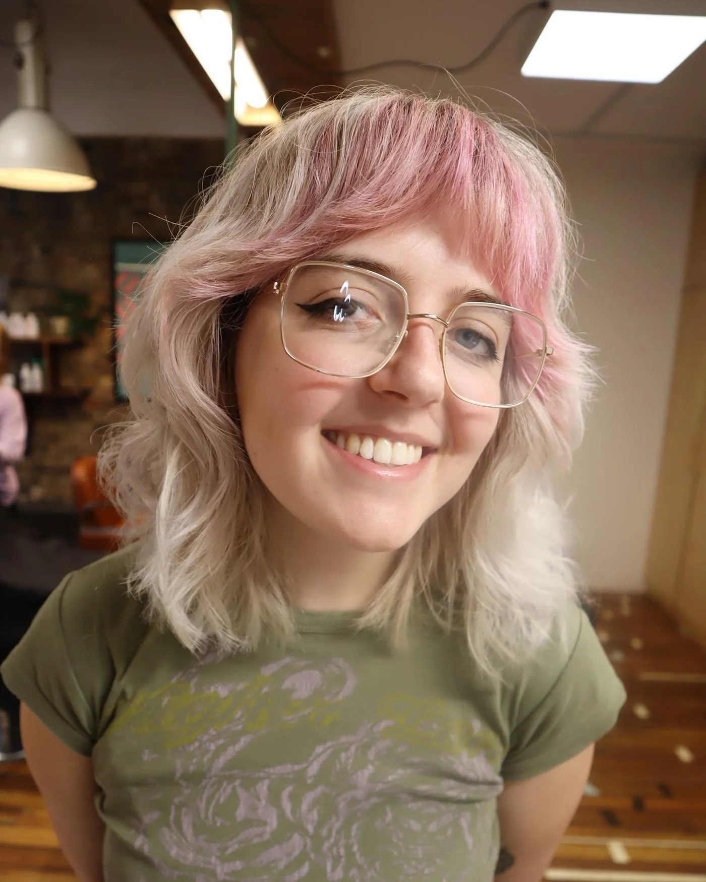 shoulder wavy pink shag with wispy fringe shown as a bangs for round face idea