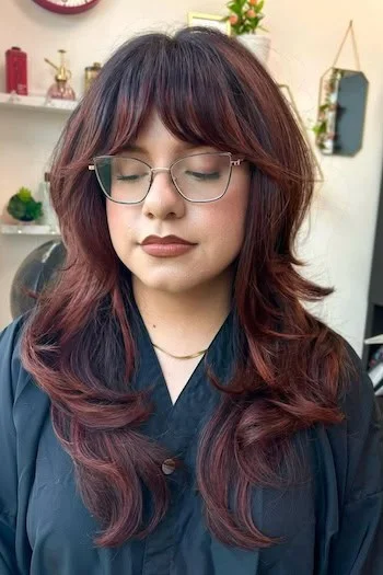 shoulder wavy burgundy shag with curtain fringe shown as a bangs for round face idea