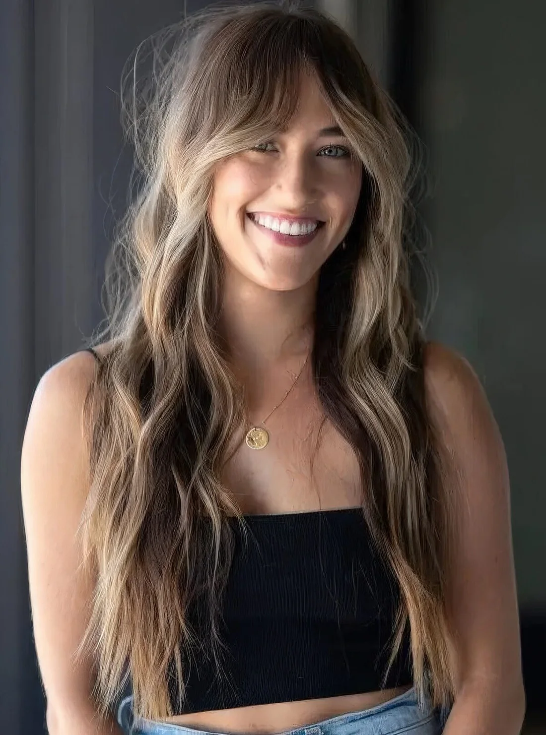 Photo showing curtain bangs hairstyle, with the hairstyle clearly visible.