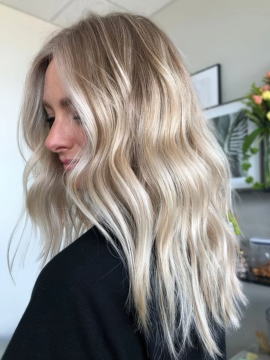 Chic bright blonde balayage with a bit darker root but not too much.
