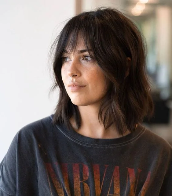 Photo showing long bob hairstyle, with the hairstyle clearly visible.