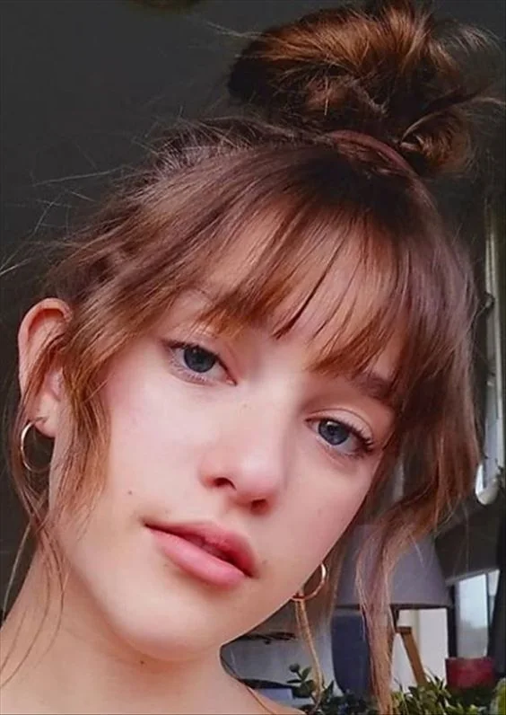 Photo showing top knot hairstyle, with the hairstyle clearly visible.