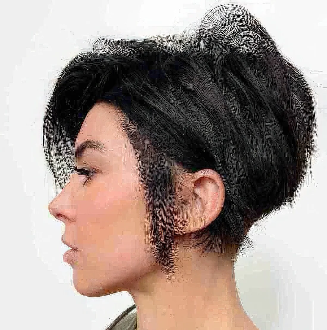 Photo showing bixie with a side part, with the hairstyle clearly visible.