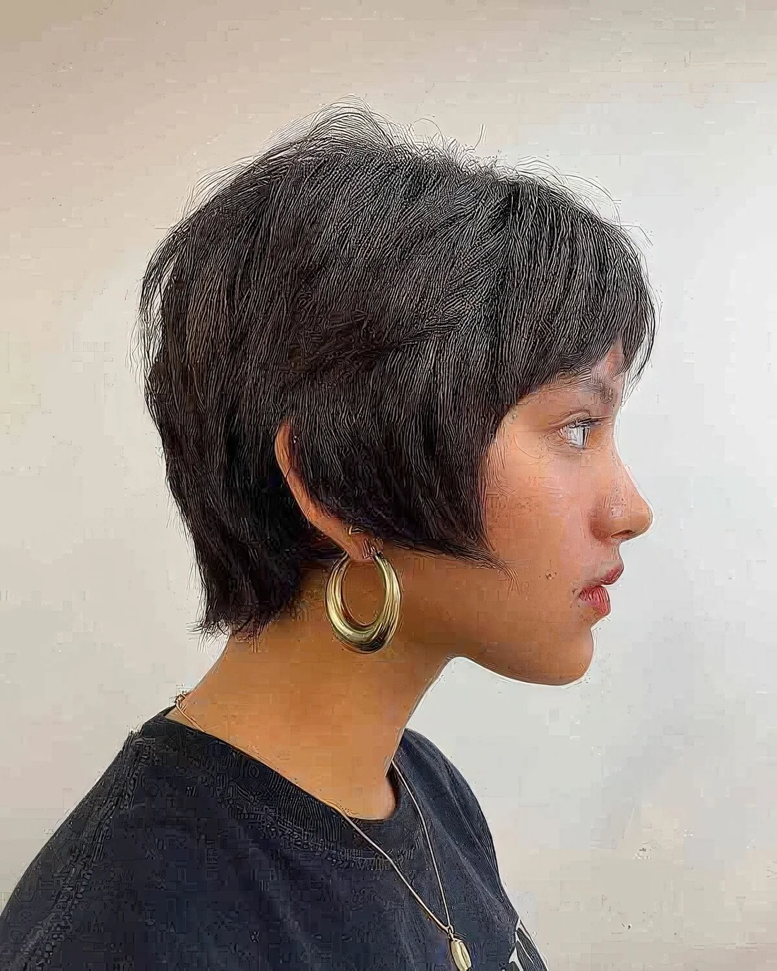 Photo showing 90s inspired bixie haircut, with the hairstyle clearly visible.