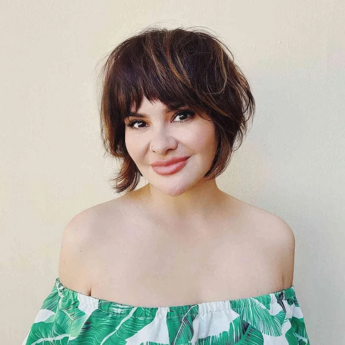 Shagged out bixie cut with short choppy bangs.