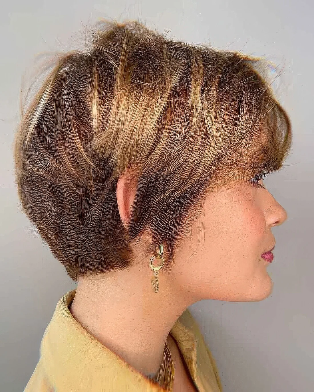 Textured bixie haircut with tapered layers.