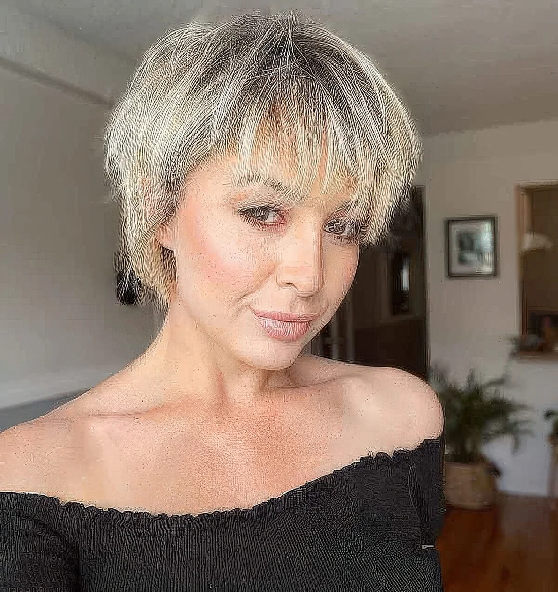 Tousled blonde bixie with wispy bangs.