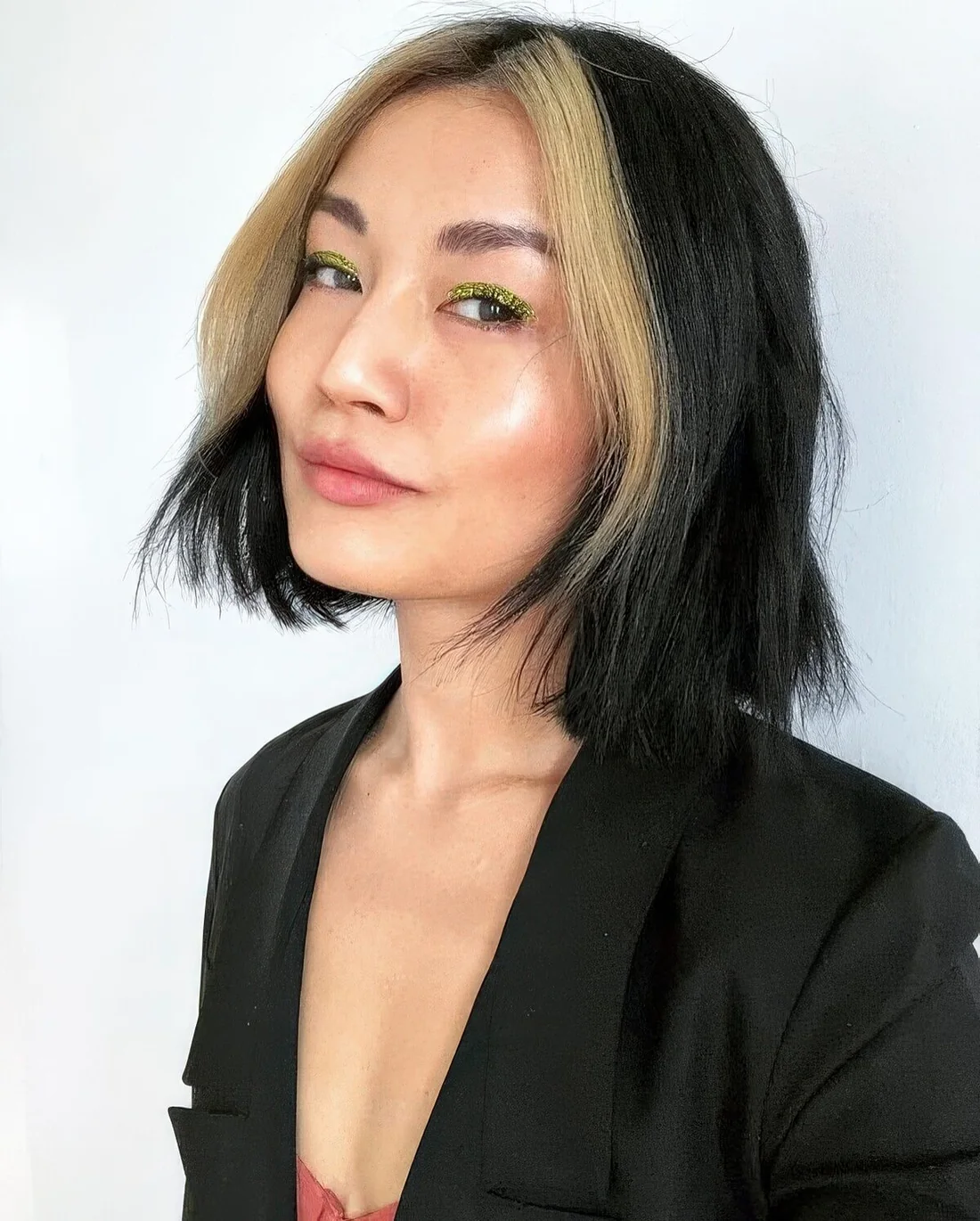Black bob with a blonde money piece.