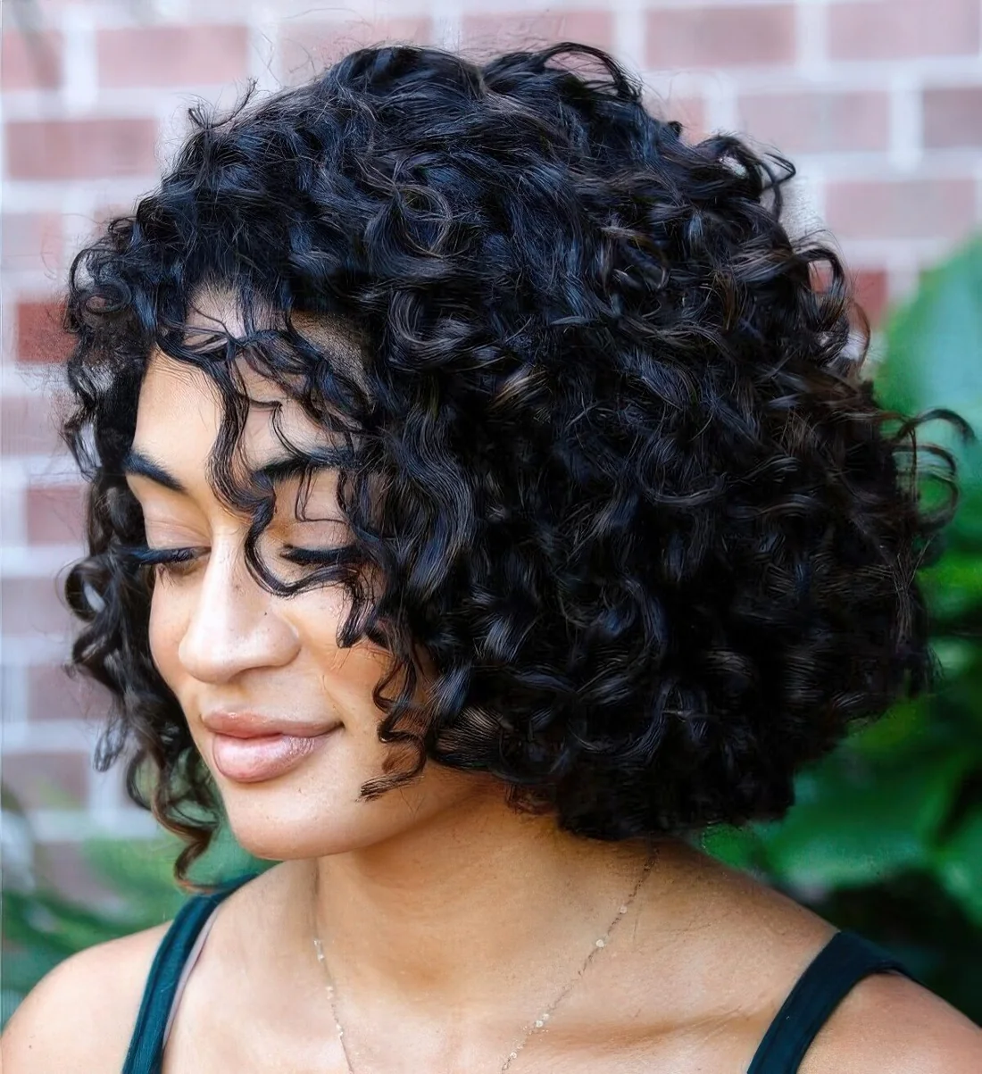 Photo showing curly bob hairstyle, with the hairstyle clearly visible.