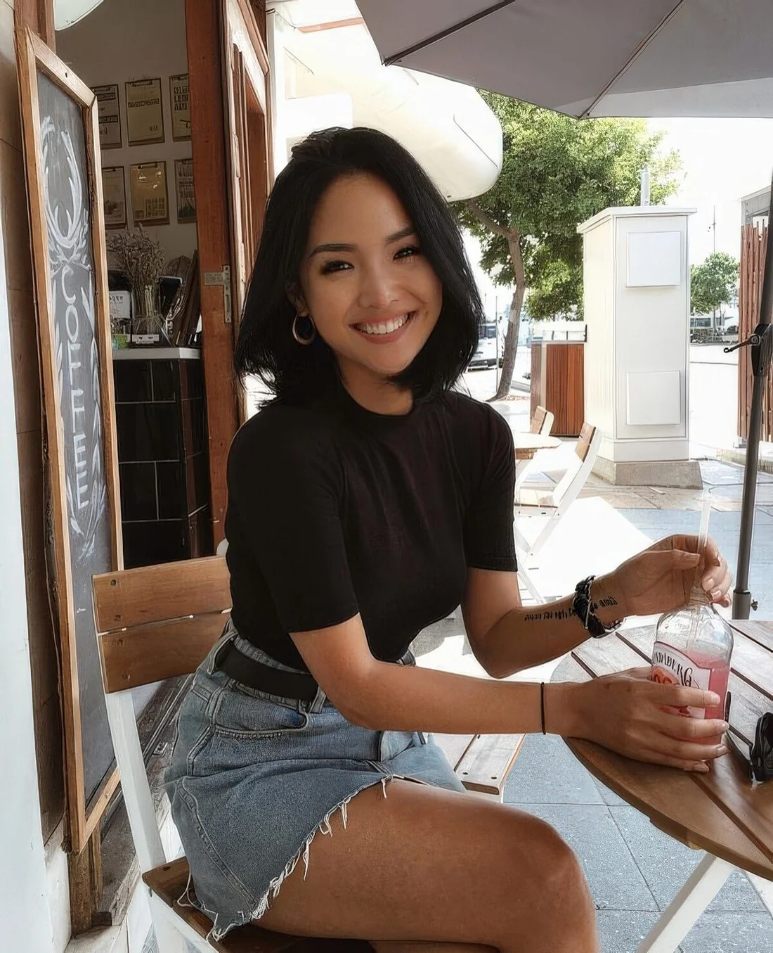 Photo showing dimensional black long bob, with the hairstyle clearly visible.