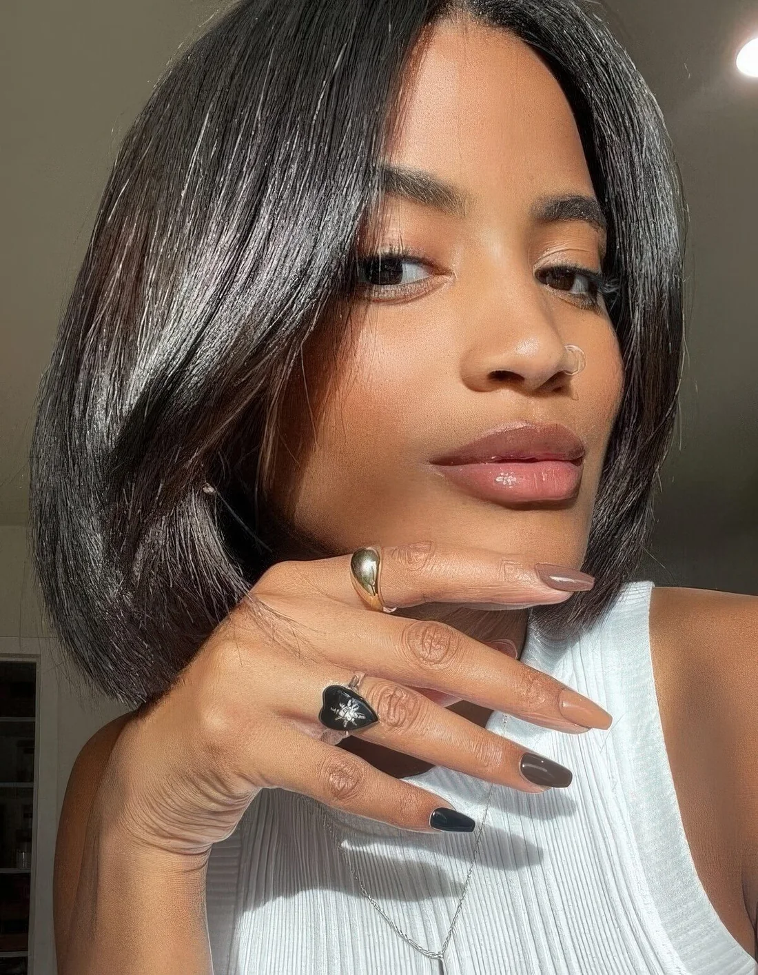 Fab and shiny black liquid bob withcurtain bangs.