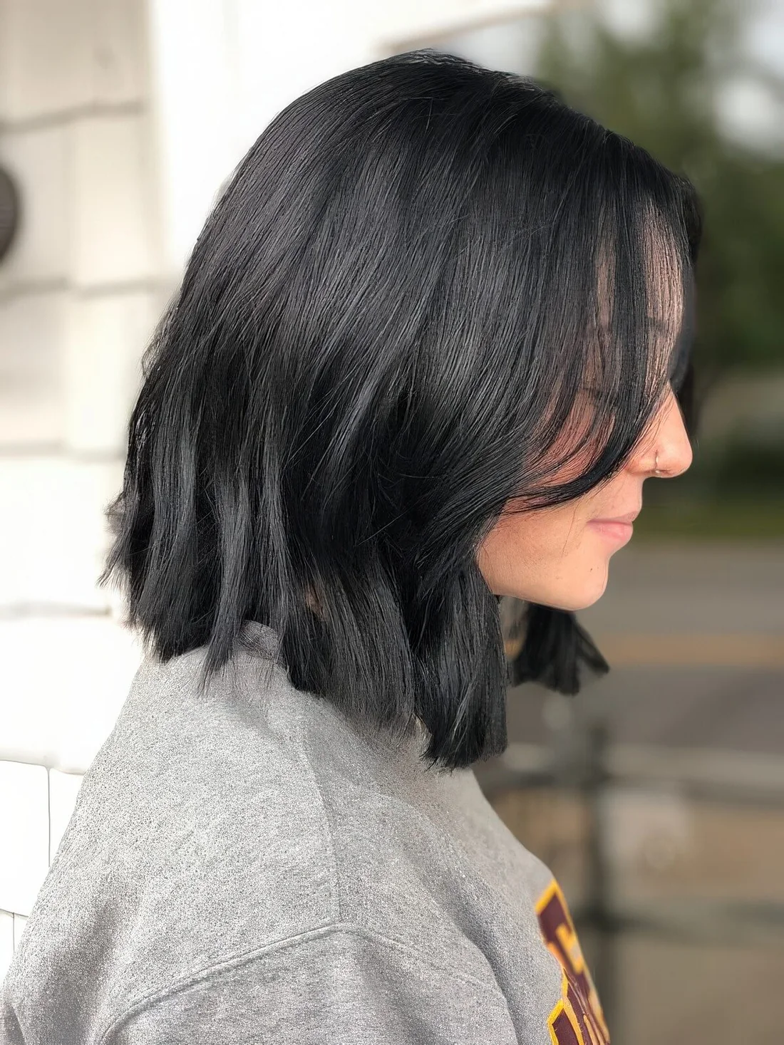 Long black bob with waves and volume.