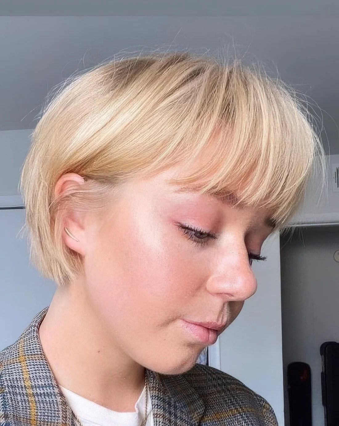 Classic blonde ear-length bob with a classic fringe.
