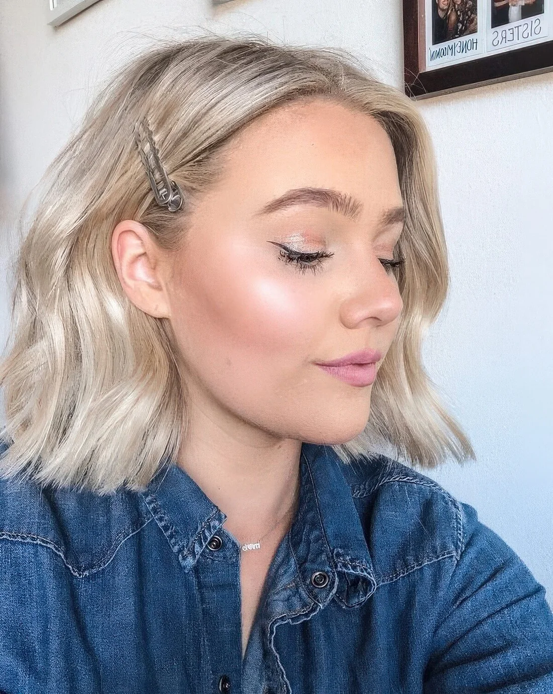 Photo showing wavy platinum blonde long bob, with the hairstyle clearly visible.