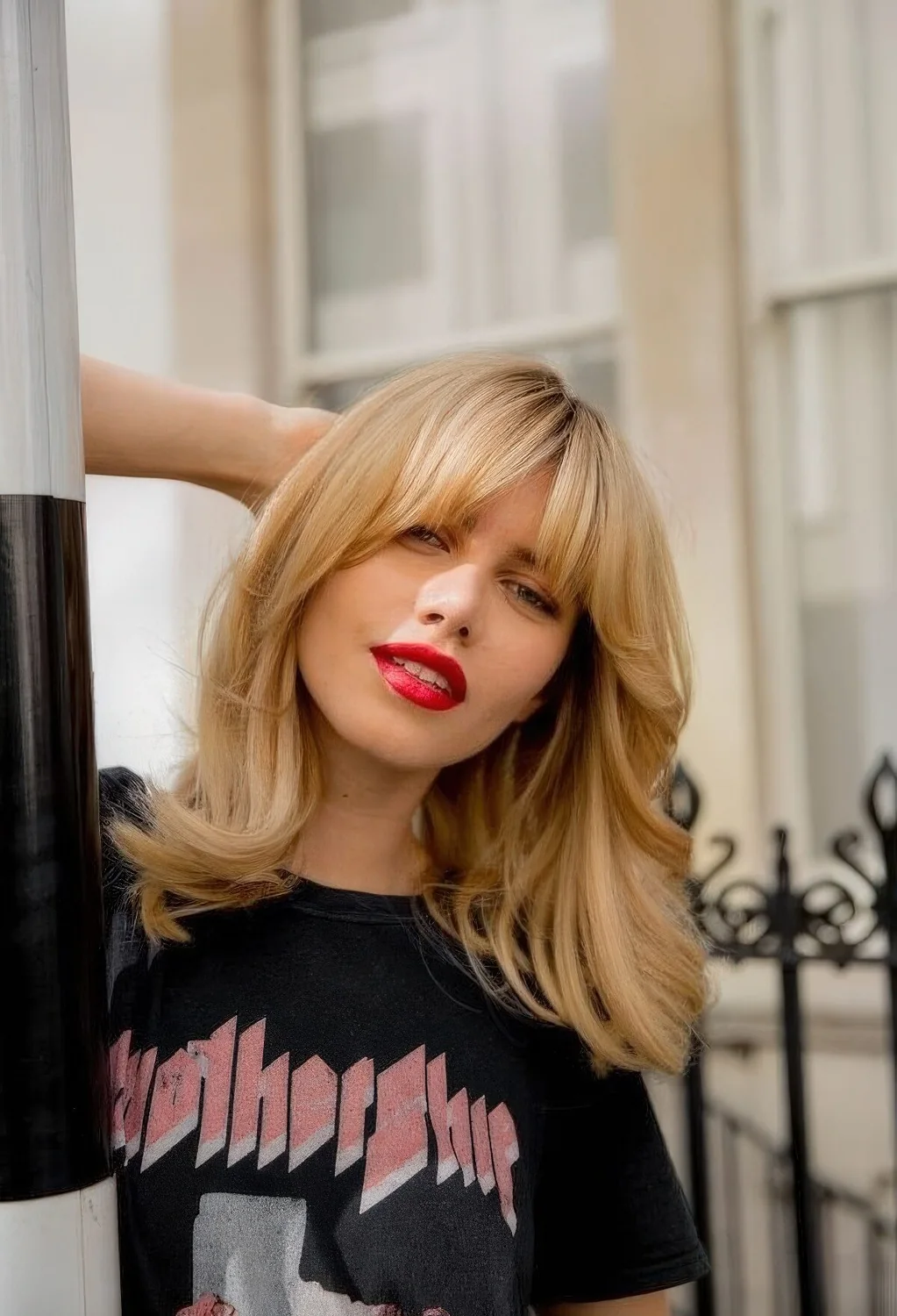 Butterfly haircut with bottleneck bangs.