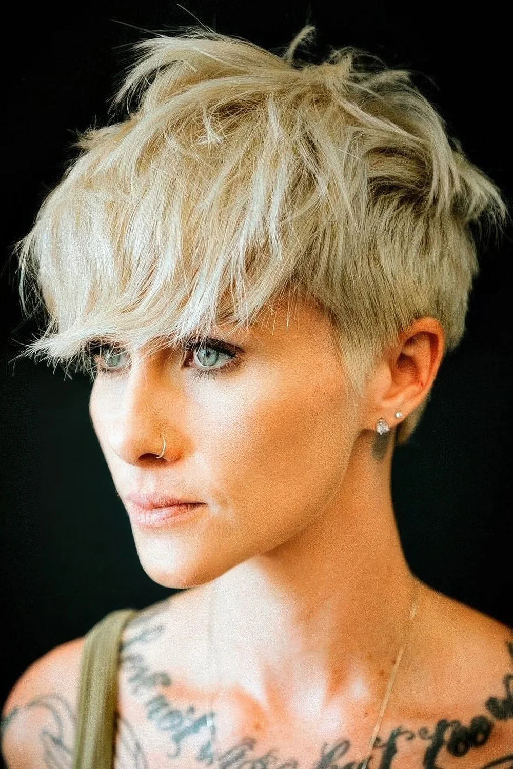 Photo showing layered pixie hairstyle, with the hairstyle clearly visible.