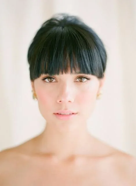 Blunt bangs are always the best way to accent the eyes or the eyebrows depending on the length of the bangs.