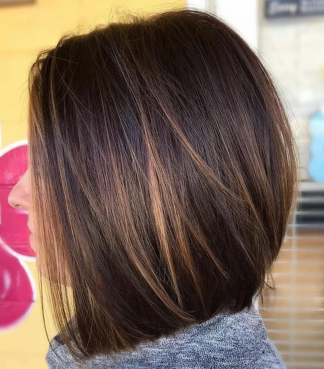 Dark brunette long bob with caramel balayage, such highlights give interest to the look.