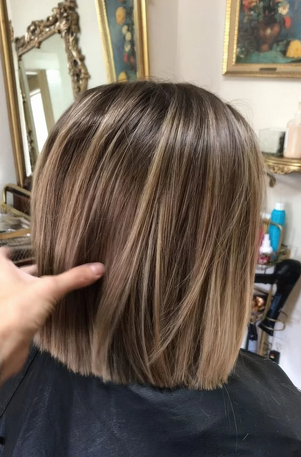 Light brown bob with blonde balayage that.