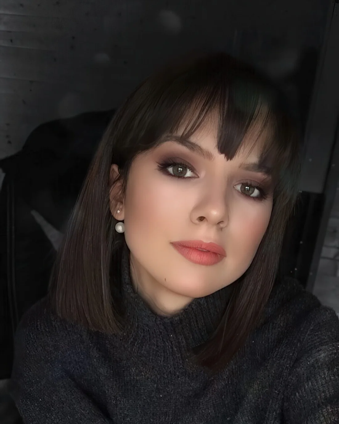 Photo showing short bob with bangs, with the hairstyle clearly visible.