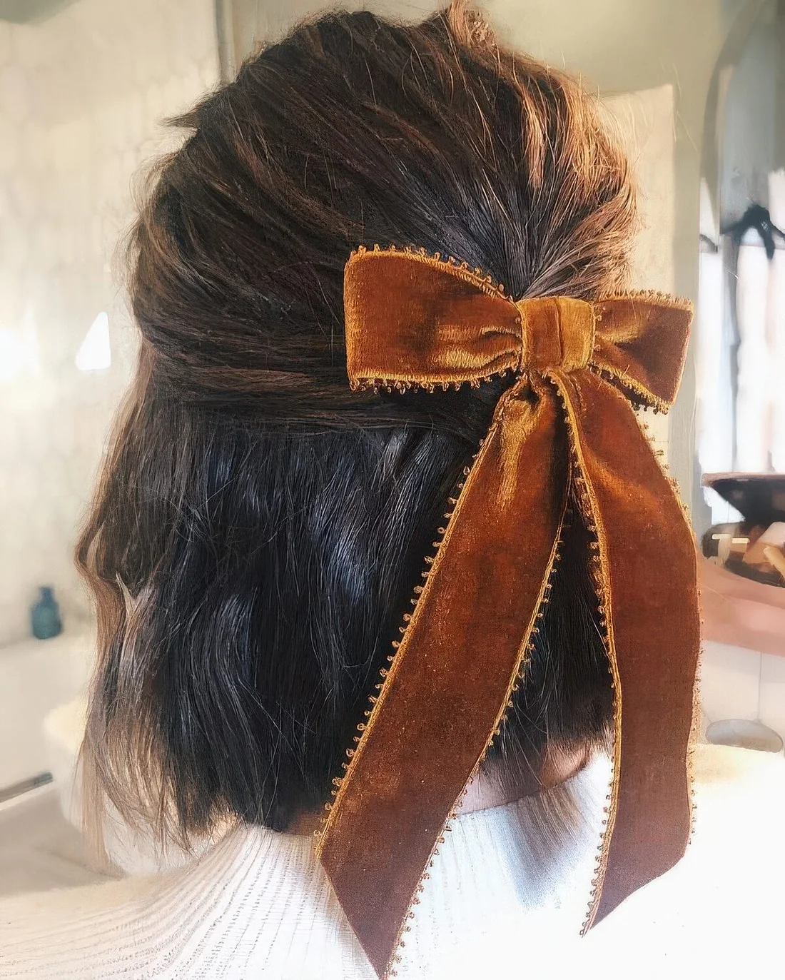 Photo showing velvet bow, with the hairstyle clearly visible.