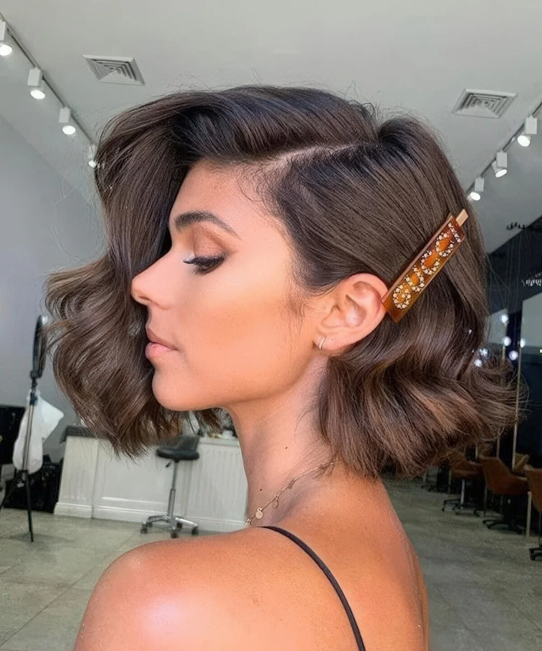 Photo showing embellished barette, with the hairstyle clearly visible.