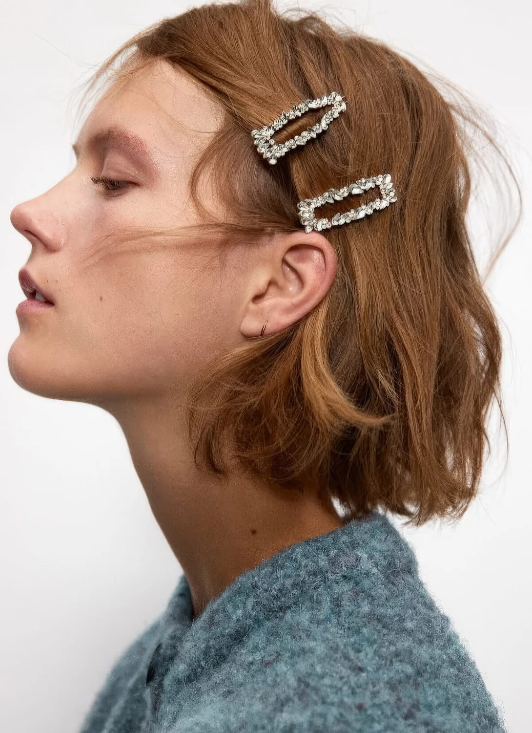 Photo showing embellished hair clips, with the hairstyle clearly visible.