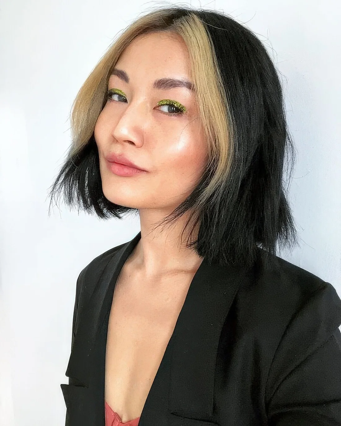 Black bob with a blonde money piece.